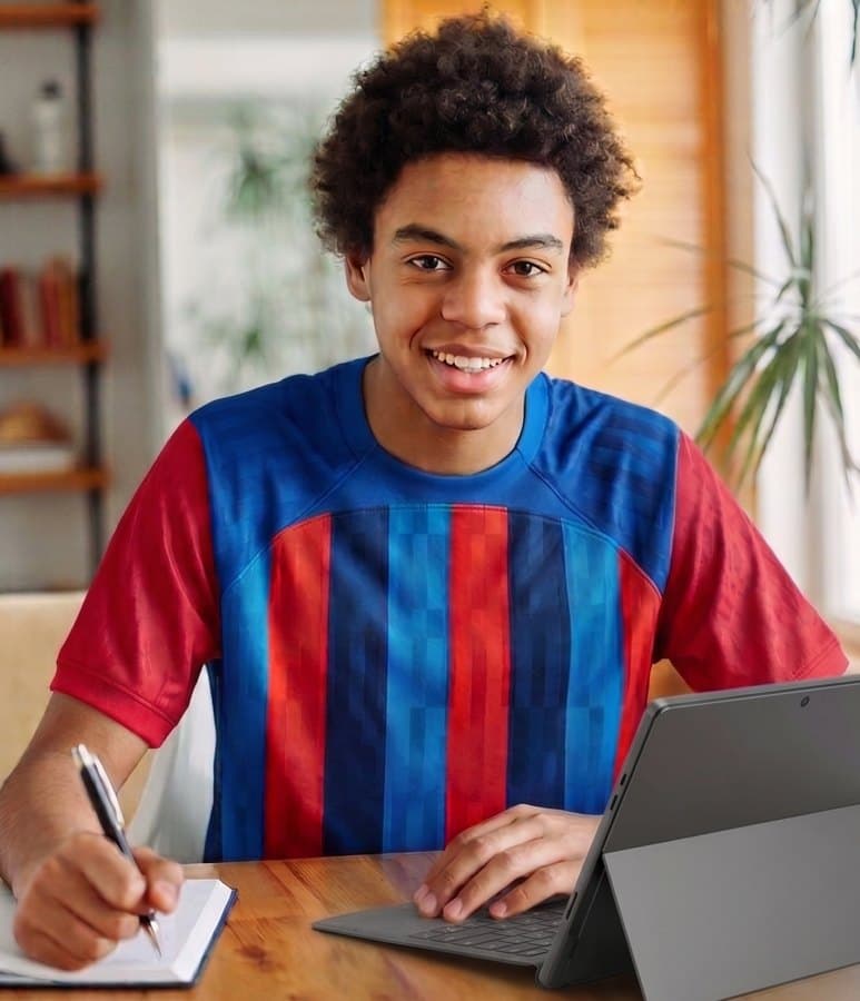 A student working at a laptop